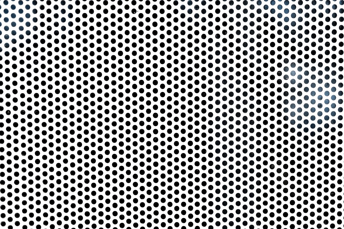 Background sheet of metal with circular holes