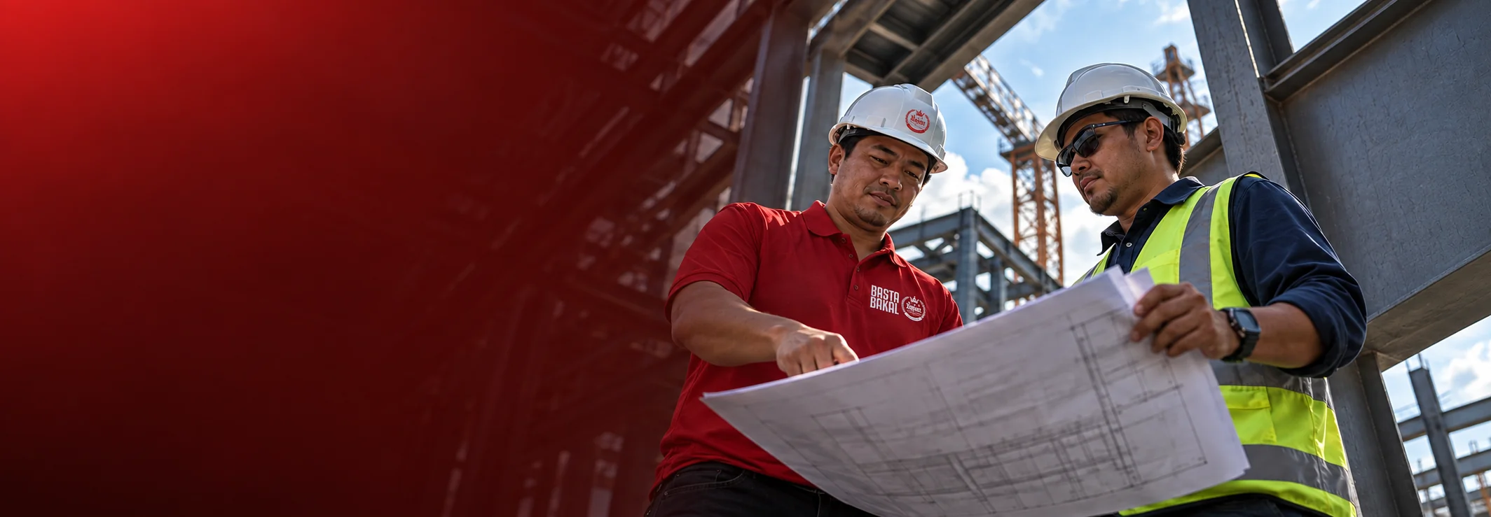 Regan staff member and a client reviewing project plans