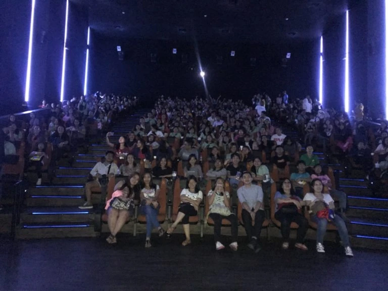 photo inside a cinema with people watching