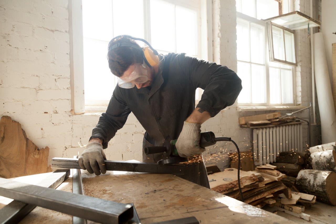 man working with steel