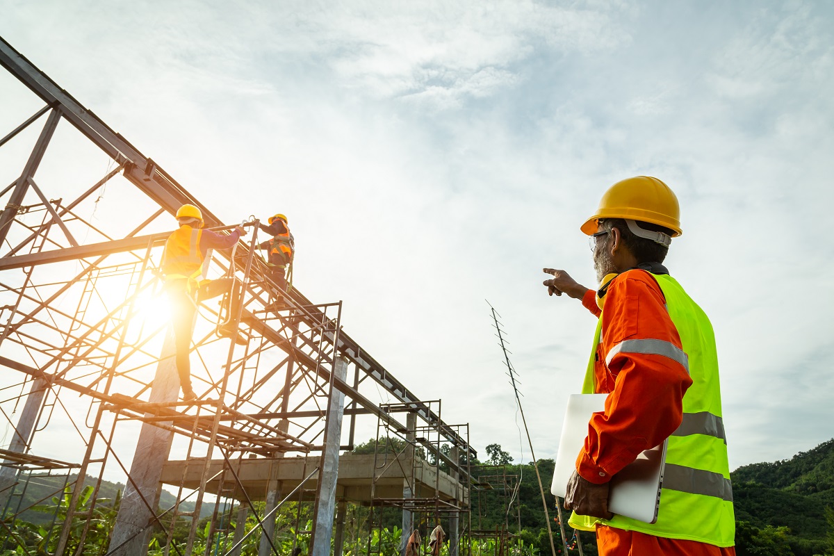 A construction worker control in Engineer technician watching te